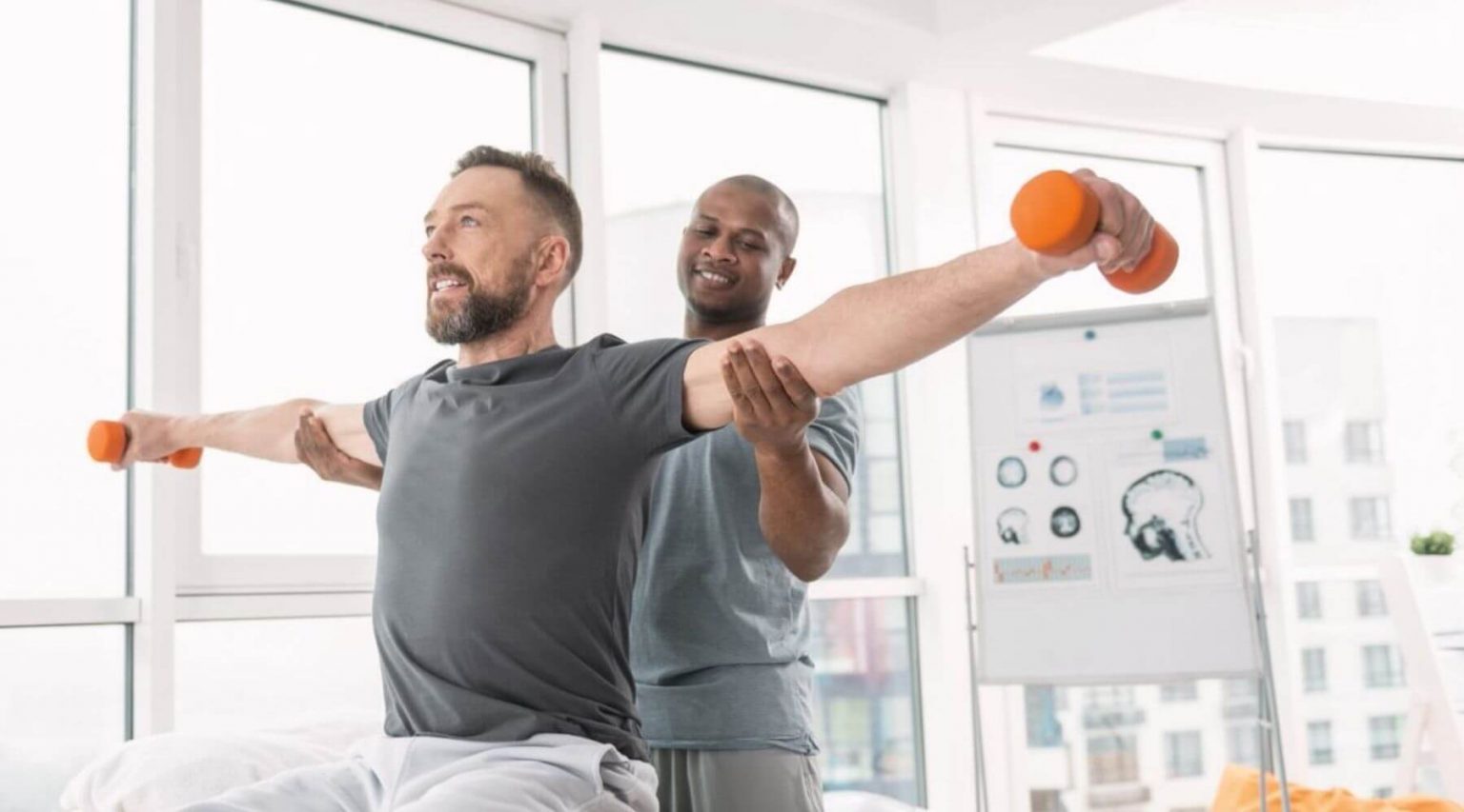 Patient holding weights long right aligned 1536x853 1